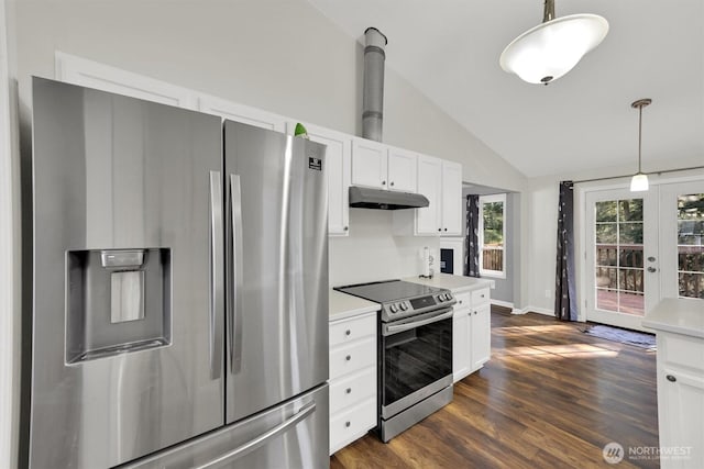 kitchen featuring lofted ceiling, white cabinetry, light countertops, appliances with stainless steel finishes, and pendant lighting