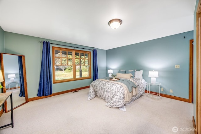 bedroom featuring carpet, visible vents, and baseboards