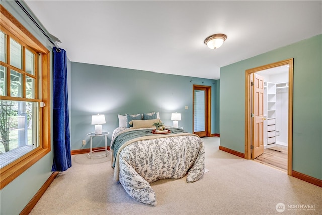 carpeted bedroom featuring baseboards