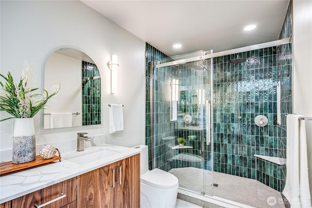 full bath featuring toilet, a shower stall, recessed lighting, and vanity