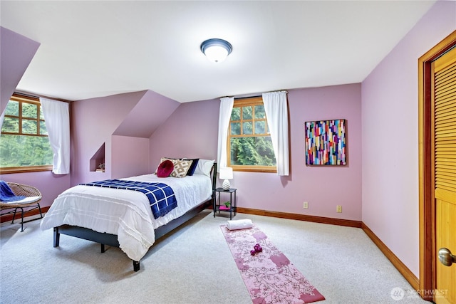 bedroom featuring carpet and baseboards