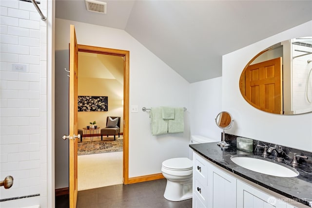 bathroom with toilet, a shower, visible vents, and vaulted ceiling