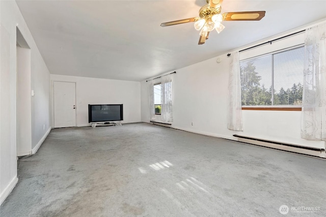 unfurnished living room with ceiling fan and baseboards