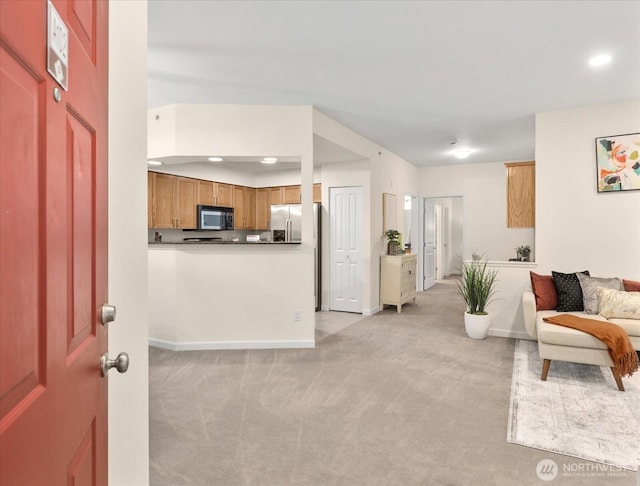 interior space with light colored carpet and baseboards