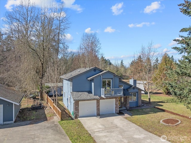 view of front of home featuring brick siding, a chimney, concrete driveway, an attached garage, and a front yard