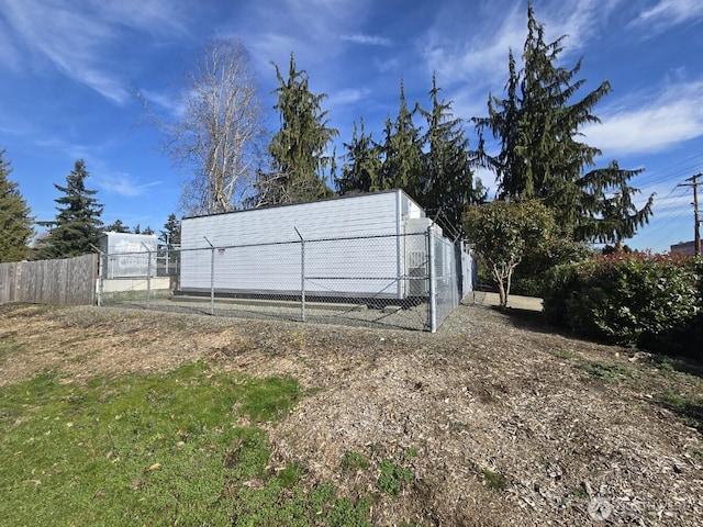 view of outdoor structure with fence