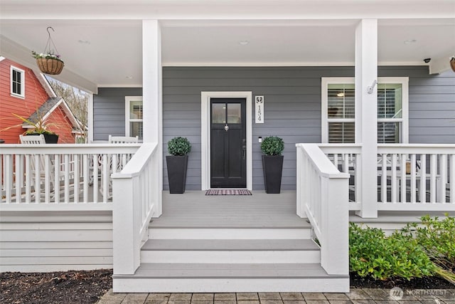 doorway to property with covered porch