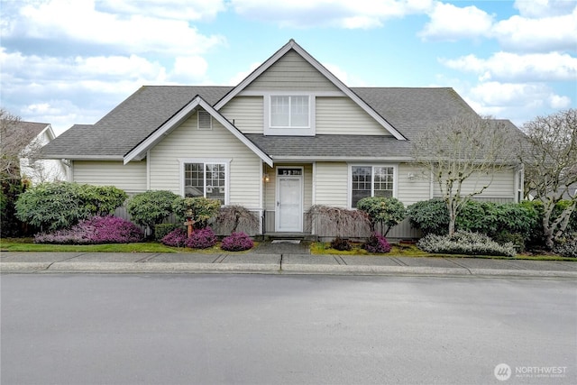 view of front of home featuring roof with shingles