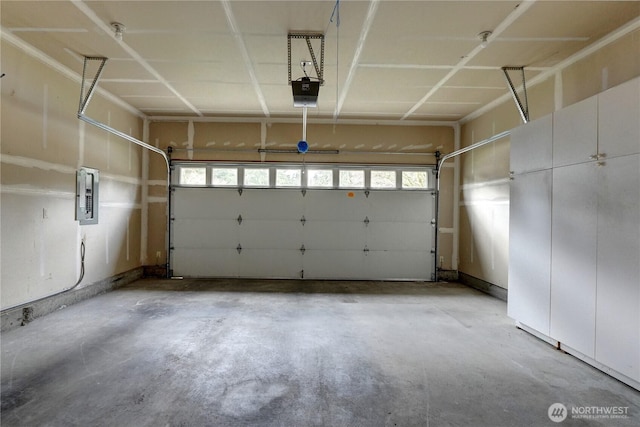 garage featuring electric panel and a garage door opener