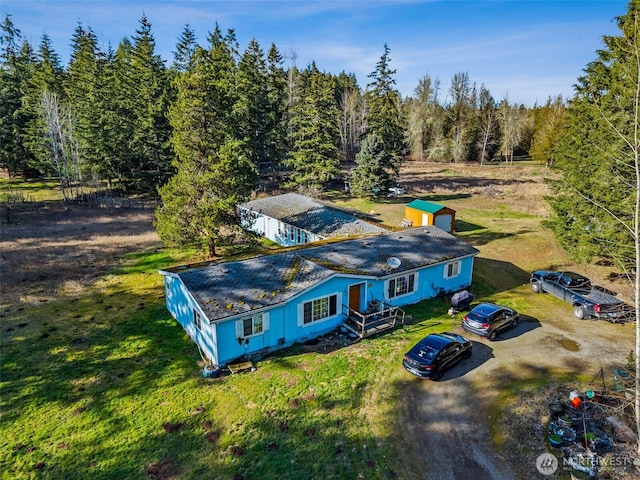 aerial view with a wooded view