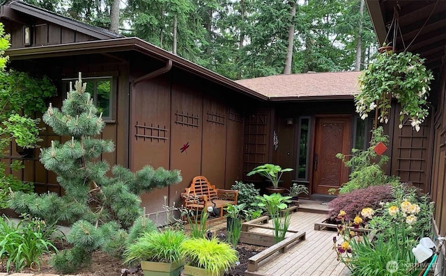 view of exterior entry featuring board and batten siding