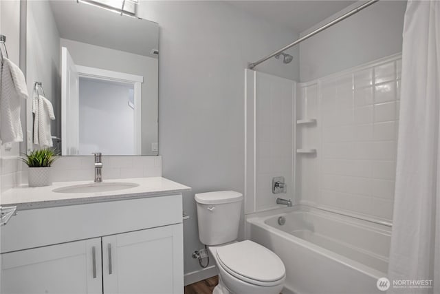 full bathroom featuring vanity, toilet, and shower / bath combo with shower curtain