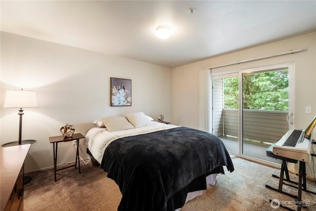 bedroom with access to outside and carpet floors