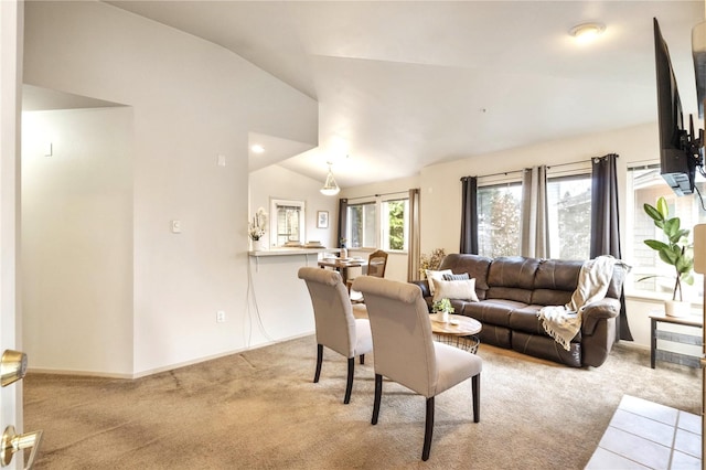 11130 SE 208th St Unit J204, Kent, WA 98031 - living room with baseboards, vaulted ceiling, and light colored carpet