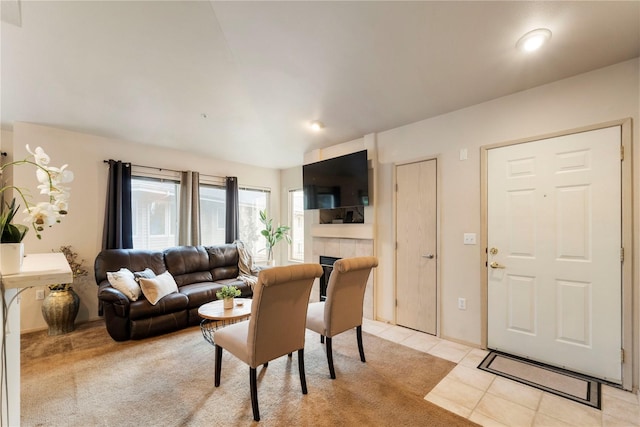 11130 SE 208th St Unit J204, Kent, WA 98031 - living area featuring light tile patterned floors, a fireplace, and light colored carpet