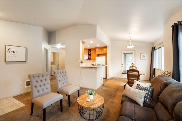 11130 SE 208th St Unit J204, Kent, WA 98031 - living area featuring visible vents, light colored carpet, washer / clothes dryer, and lofted ceiling