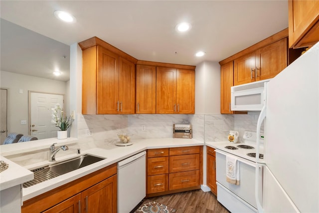 11130 SE 208th St Unit J204, Kent, WA 98031 - kitchen featuring decorative backsplash, a sink, light countertops, white appliances, and light wood-style flooring