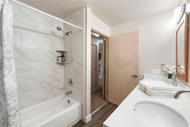 11130 SE 208th St Unit J204, Kent, WA 98031 - bathroom featuring double vanity, a sink, wood finished floors, and shower / tub combo