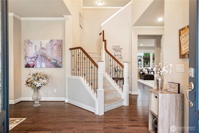 entrance foyer featuring ornamental molding, stairs, baseboards, and dark wood-style flooring