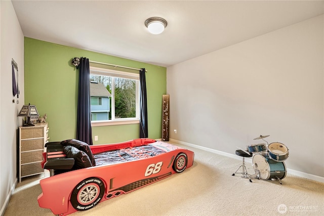 carpeted bedroom featuring baseboards