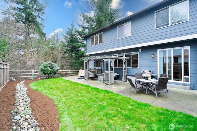 rear view of house with a patio area, a lawn, a fenced backyard, and a pergola