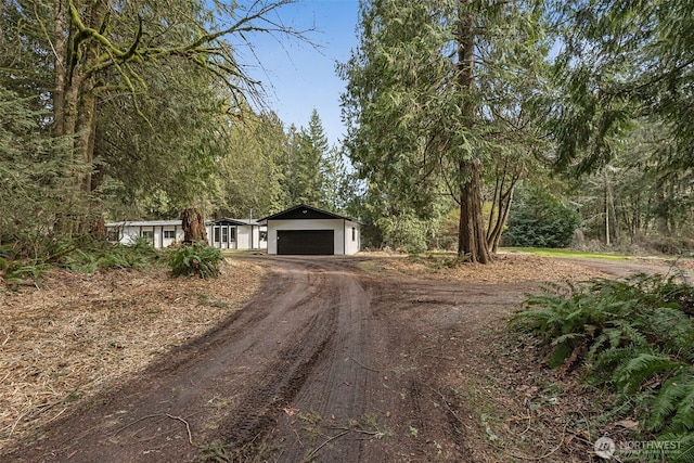 view of front of property featuring a garage and driveway