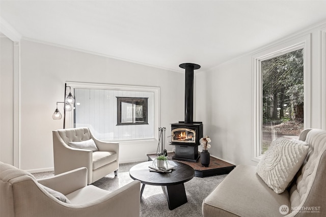 carpeted living area featuring crown molding and a wood stove