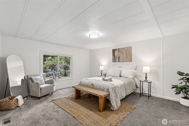 carpeted bedroom with visible vents and baseboards