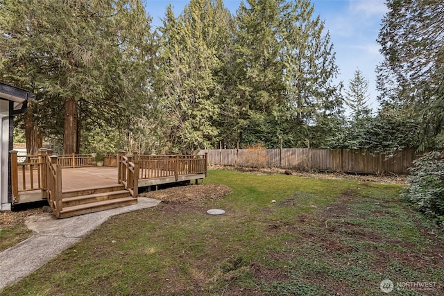 view of yard with fence and a wooden deck