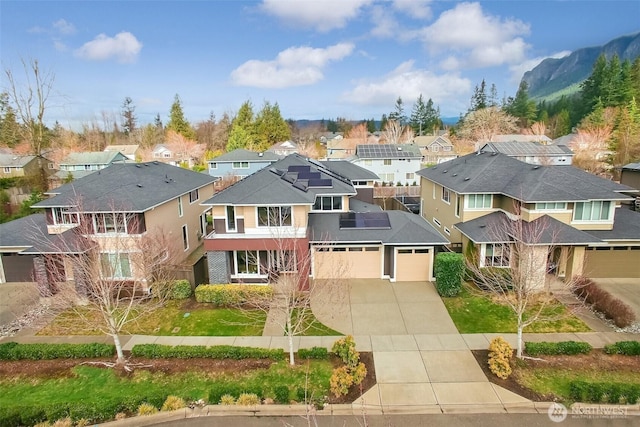 view of front of house with a residential view and driveway