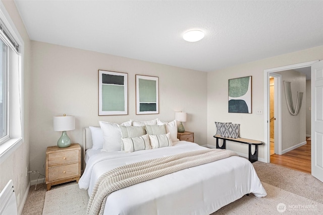 bedroom featuring carpet floors and baseboards