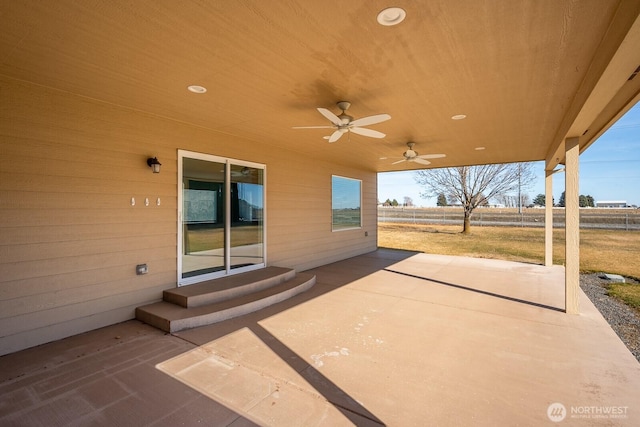 view of patio with entry steps and a ceiling fan