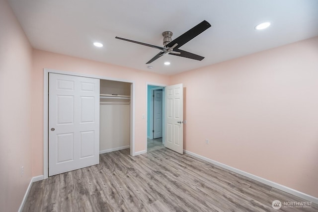 unfurnished bedroom with light wood finished floors, a closet, recessed lighting, and baseboards