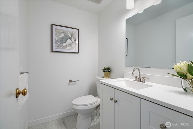 half bathroom with visible vents, baseboards, toilet, marble finish floor, and vanity