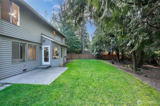 view of yard featuring fence and a patio