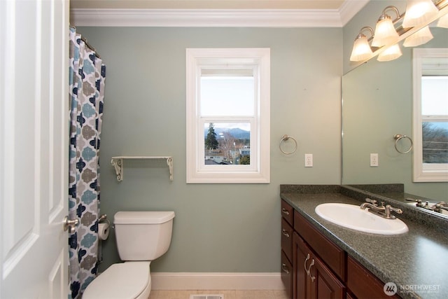 bathroom with vanity, baseboards, ornamental molding, and toilet