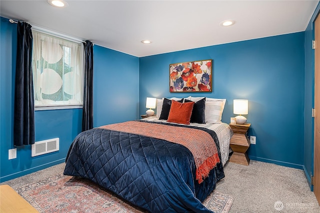 carpeted bedroom with recessed lighting, visible vents, and baseboards