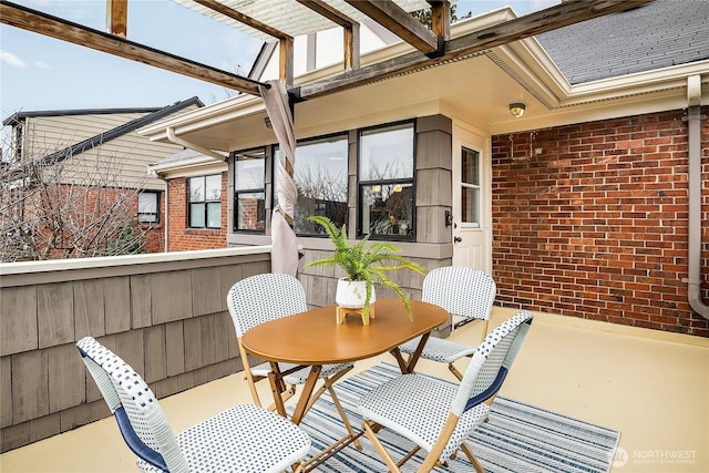 view of patio featuring outdoor dining area