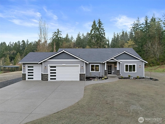 view of front of house featuring driveway, a shingled roof, a garage, and stone siding
