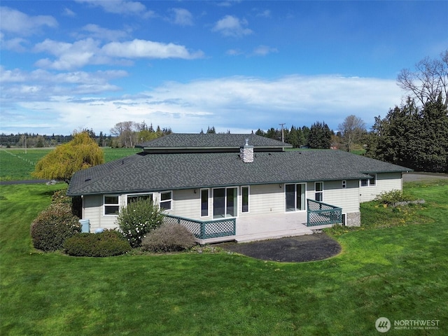 602 Mccomb Rd, Sequim, WA 98382 - back of property with a yard, roof with shingles, and a patio area