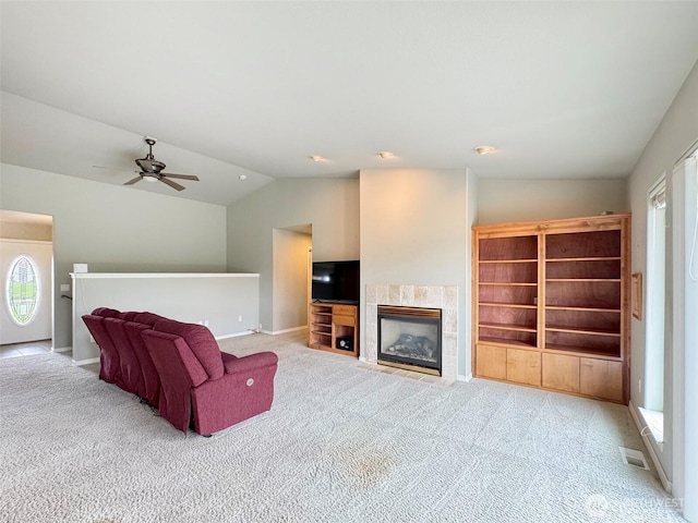 602 Mccomb Rd, Sequim, WA 98382 - living area with a fireplace, a ceiling fan, visible vents, carpet floors, and lofted ceiling