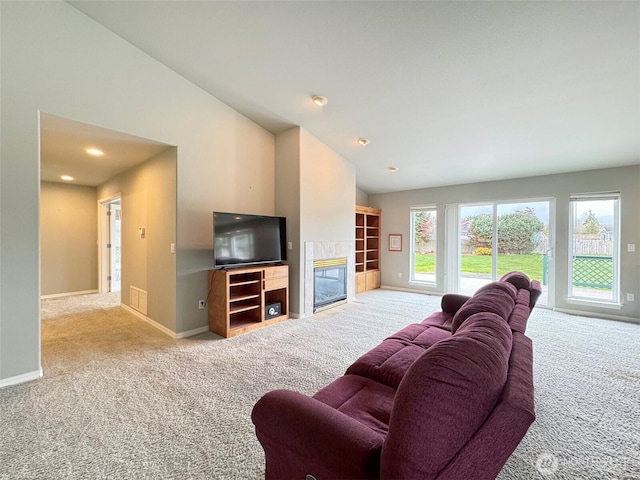 602 Mccomb Rd, Sequim, WA 98382 - living area with a fireplace, baseboards, and carpet floors