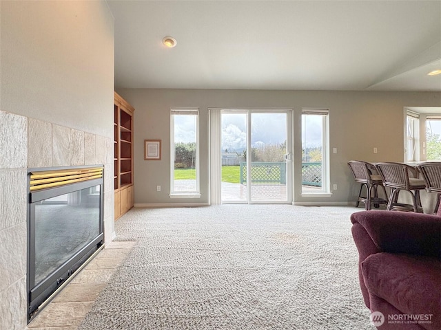 602 Mccomb Rd, Sequim, WA 98382 - living room featuring baseboards, carpet flooring, and a fireplace
