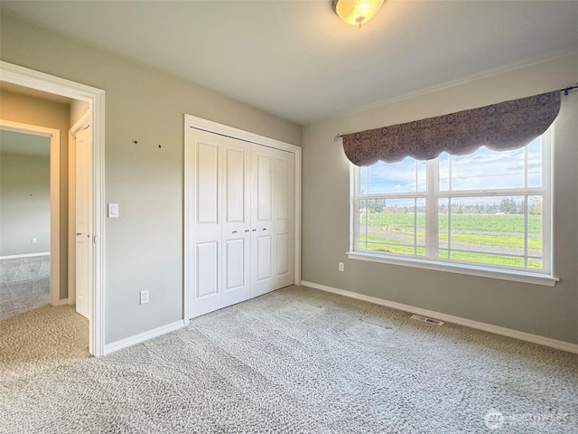 602 Mccomb Rd, Sequim, WA 98382 - unfurnished bedroom featuring a closet, baseboards, and carpet