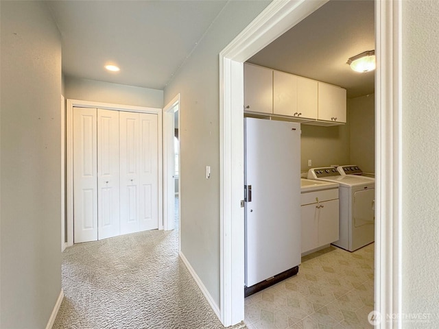 602 Mccomb Rd, Sequim, WA 98382 - interior space with washer / clothes dryer, light colored carpet, baseboards, and cabinet space