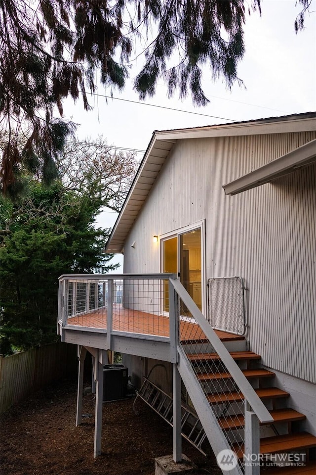 back of house with a deck, central AC, and stairway