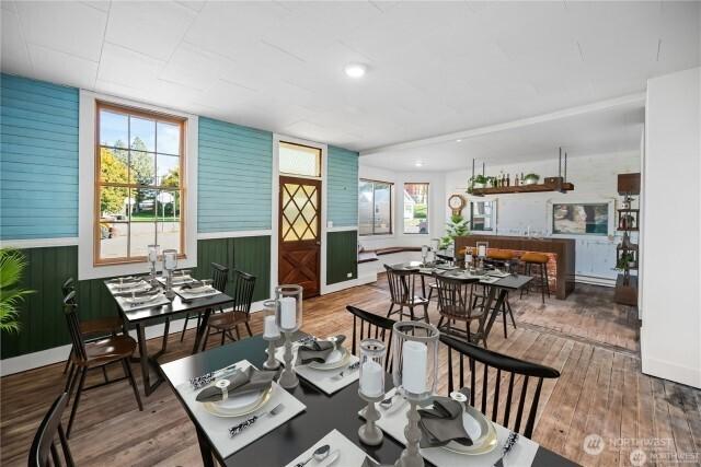 dining area featuring wood finished floors and recessed lighting