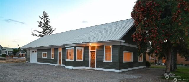 back of house with metal roof