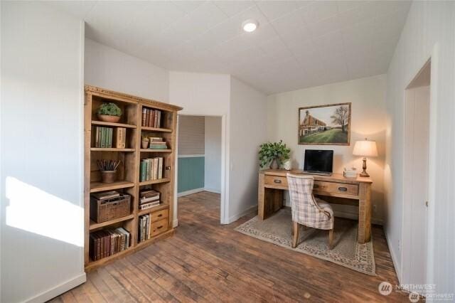 office space with baseboards and hardwood / wood-style flooring