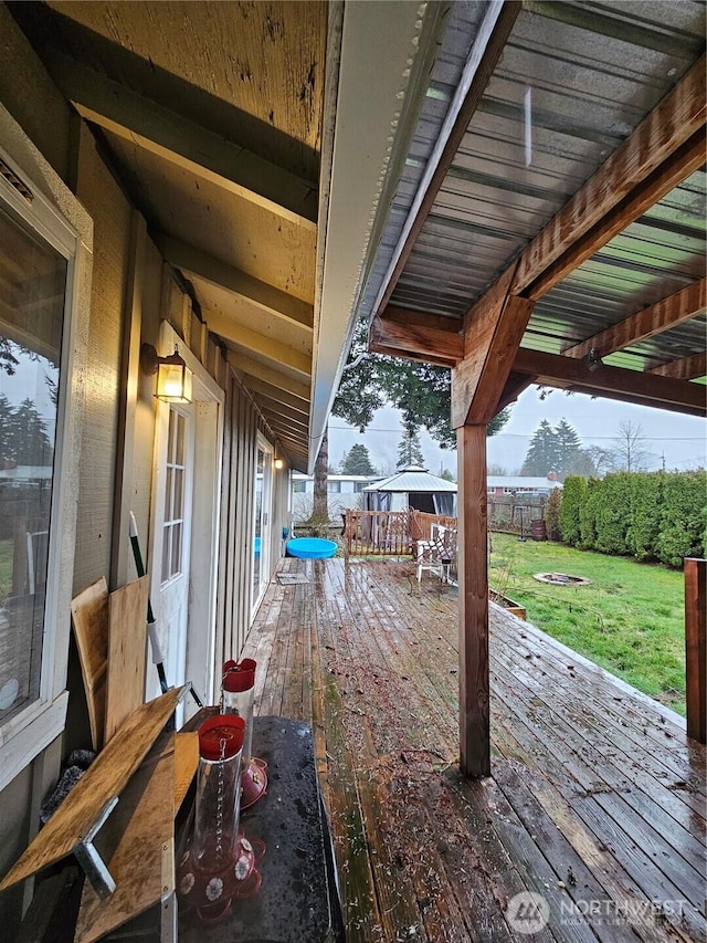 view of patio featuring fence and a deck